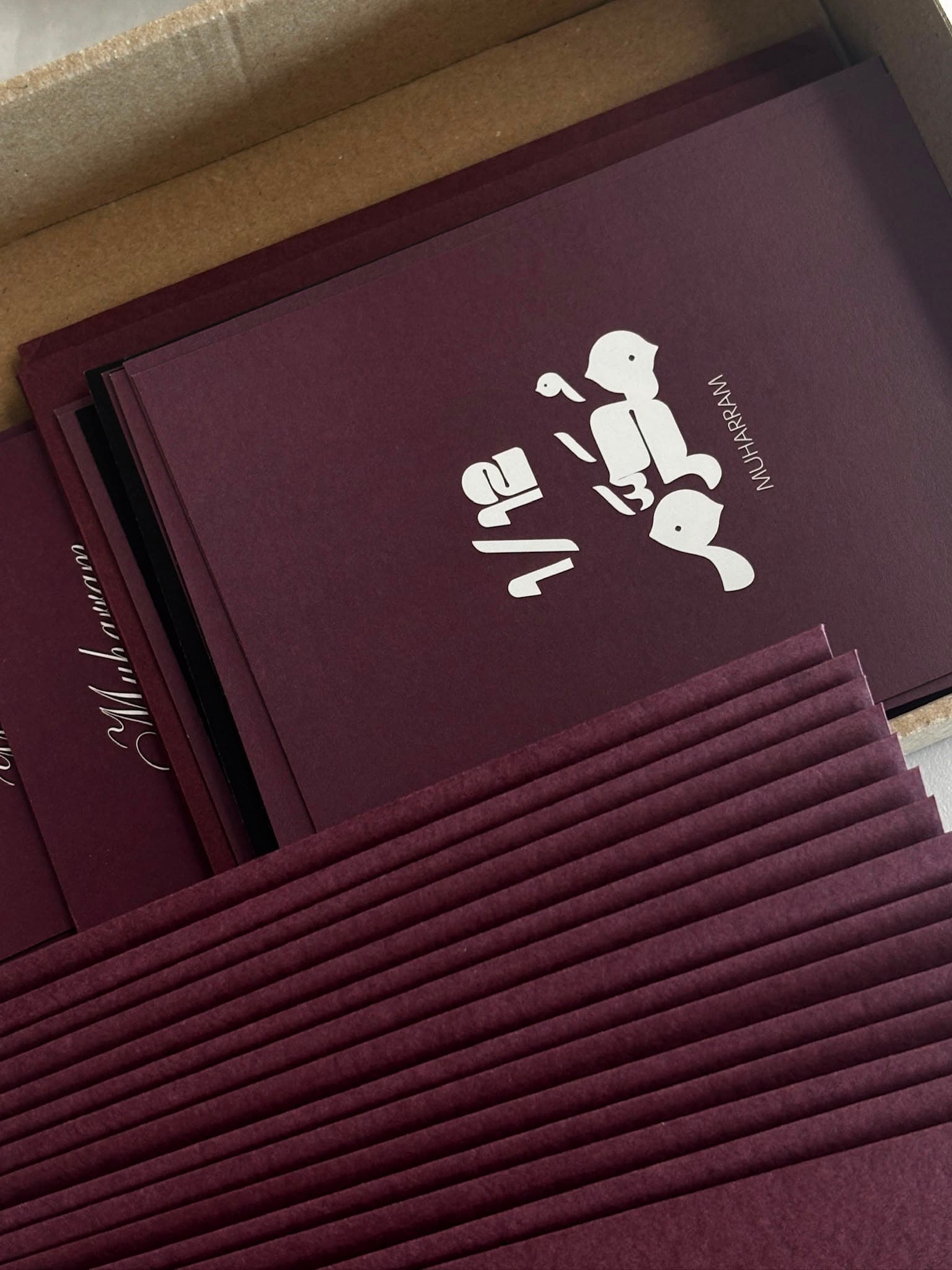 The Muharram edition card, with its bird motif